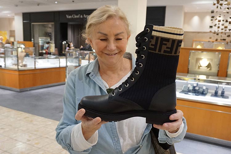 Bobbi admires a pair of beautiful Fendi combat boots.